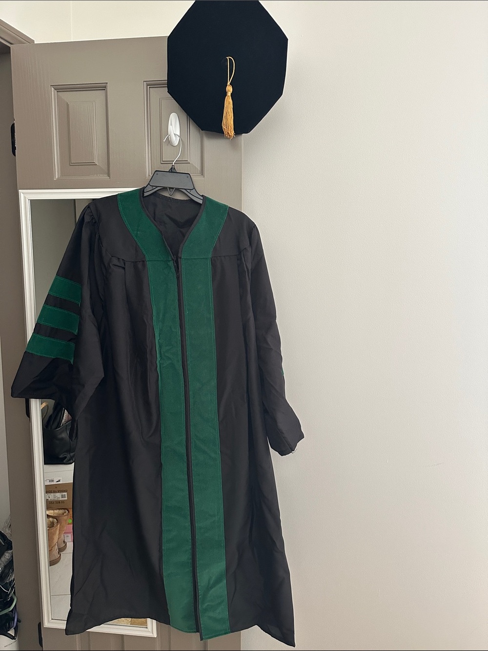 Graduation cap and gown green